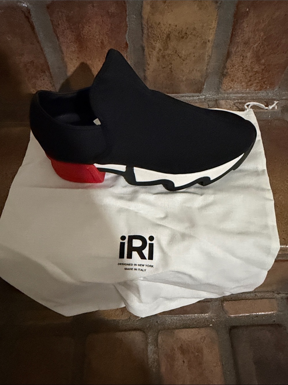 iRi Men's Black Slip-On Knit Sneaker with Red Heel Accent